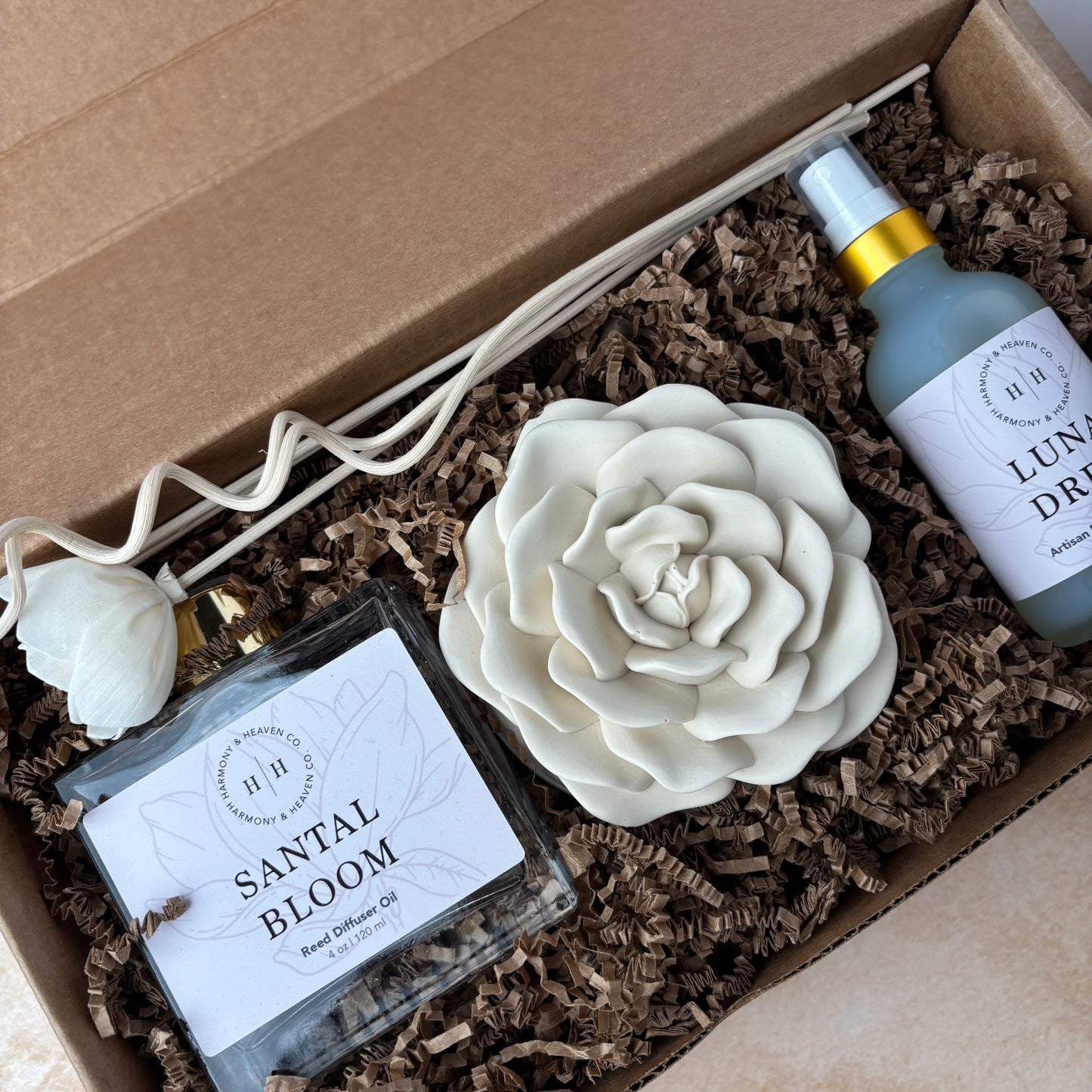 Gift Box set including rose candle, reed diffuser, room spray, and diffuser reeds