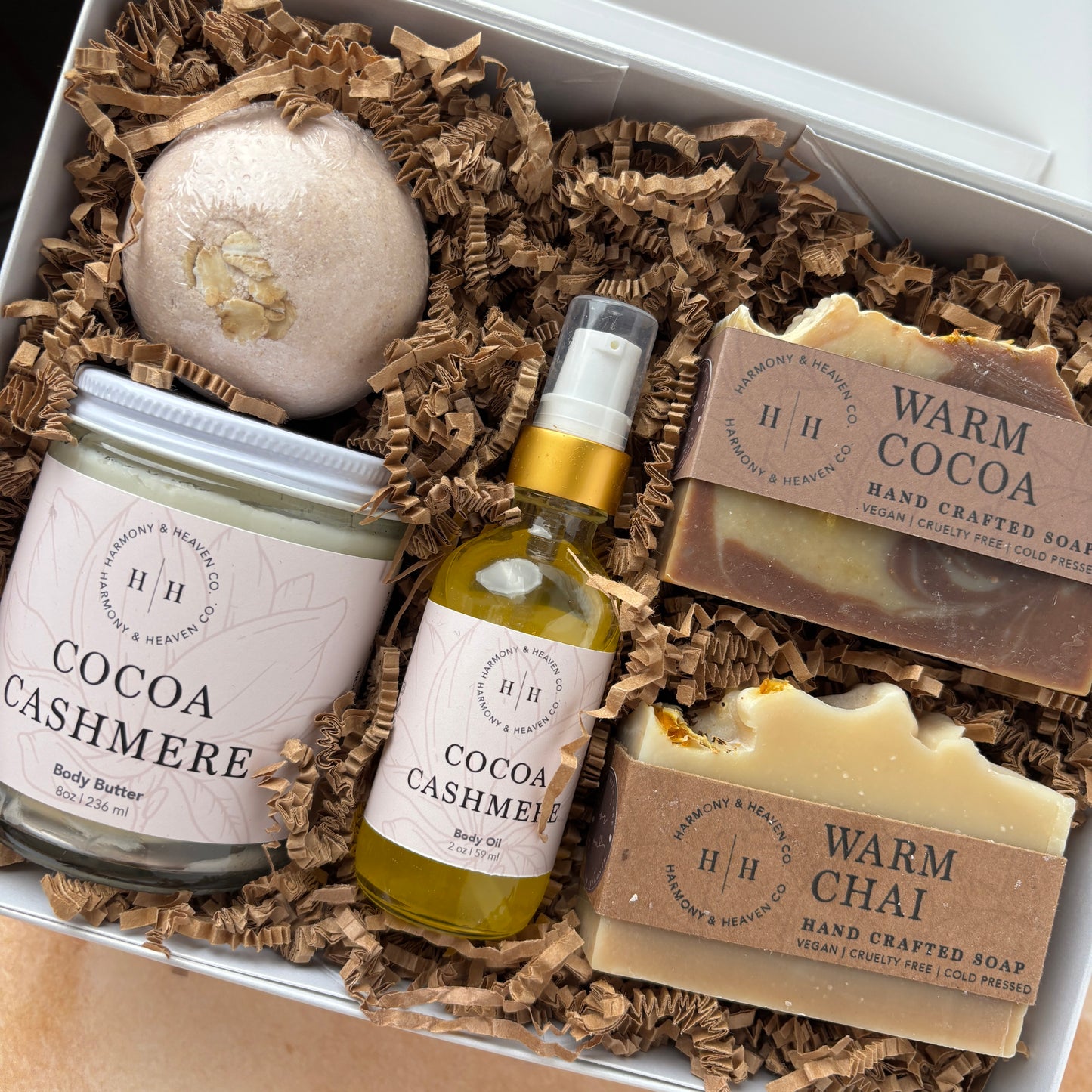 Gift Box set with including a bath bomb, body butter, body oil and two soaps.